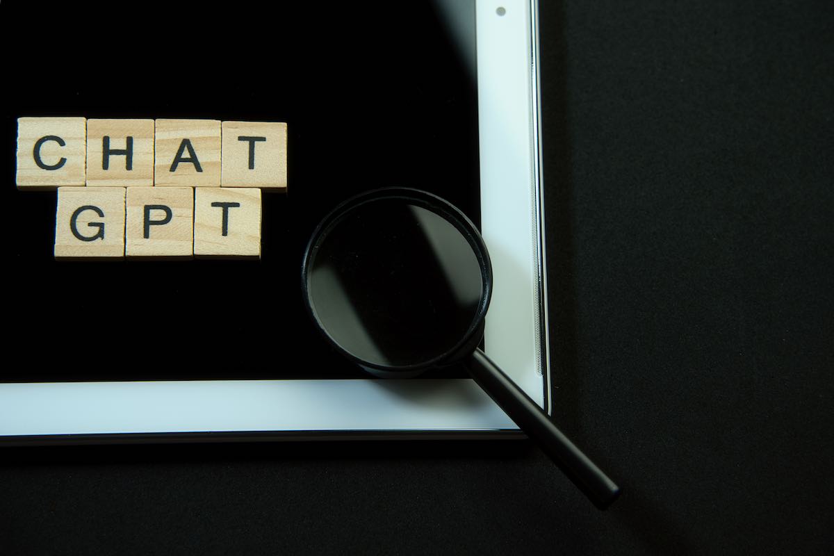 ChatGPT scrabble tiles with magnifying glass+laptop.jpg